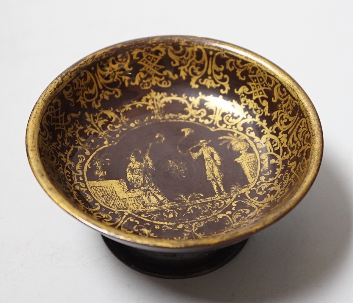 A Bayreuth glazed and gilded footed dish, c.1730-40, in imitation of Böttger stoneware, 11.2cm diameter, foot glued